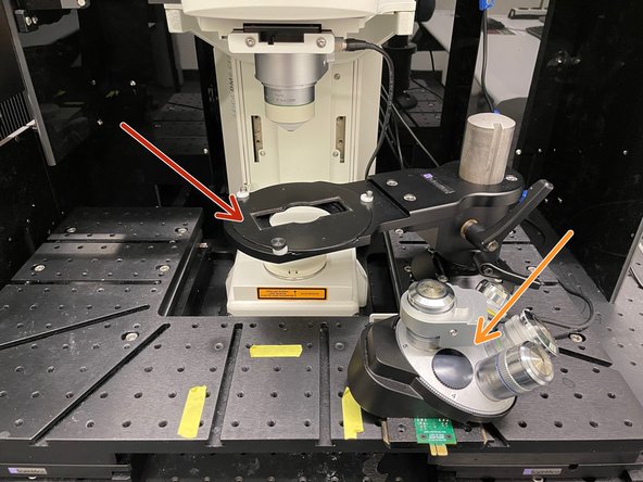 Move out the sample stage to ensure a save distance to the objective.