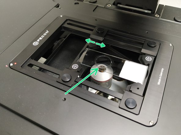 Insert your sample with the coverslip facing down .