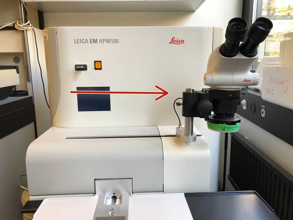 To add 100% isopropanol or ethanol, slide the binocular to the right until it comes to a stop.