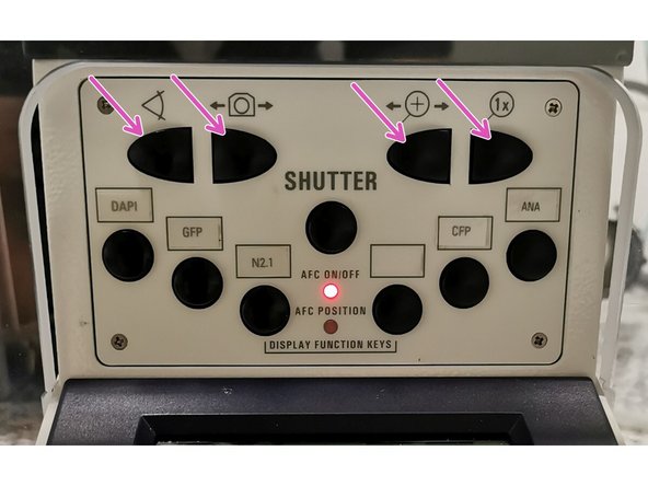 Look into the ocular and move the external focus wheel until your sample gets in focus.