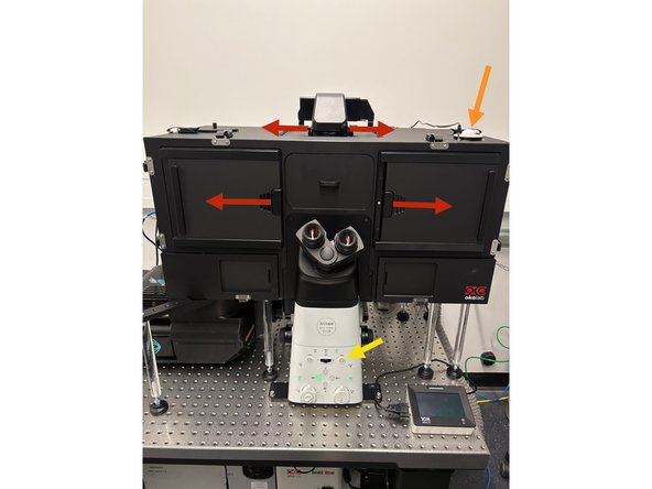 Open the black environmental control box to access the stage.