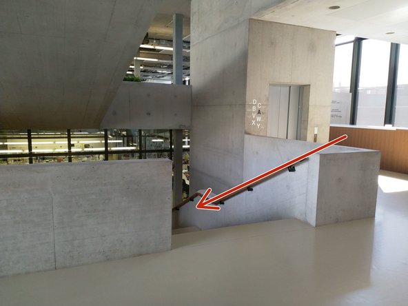 Use the stairs opposite the reception desk  to go half a floor down.