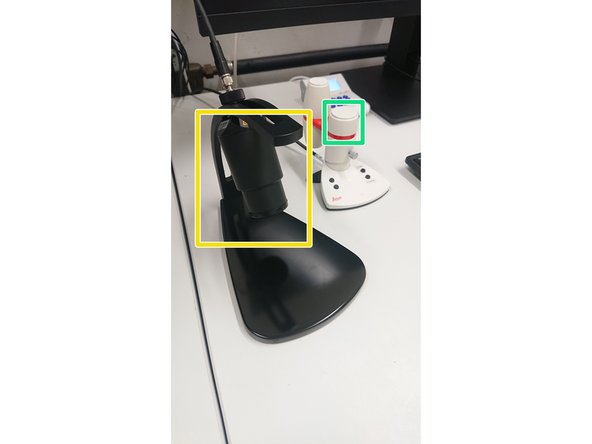 Bring the objective to the lowest position with the Z-controller (Turn it counter clockwise).