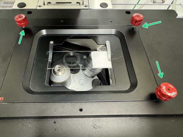 Once the z-positions of the maximum light reflection values have been found at the 4 corners have been found, you can toggle the red knobs on the sample holder in order to equalize the z-positions for all corners