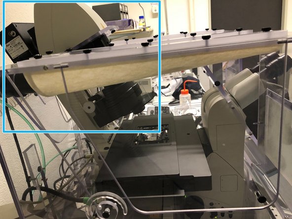 Push the condensor arm of the microscope to the back and install the chosen  sample holder.