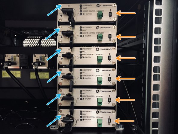 First turn on all 6 laser switches (2).
