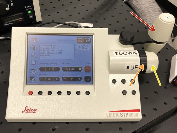 Use the controller to  position your sample in