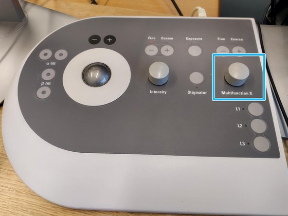 The beam will start oscillating. If the pivot points are off you will see two circular beams with little or no overlap (see the image). By turning the 'Multifunction X' knob minimize the movement until you see a single beam.