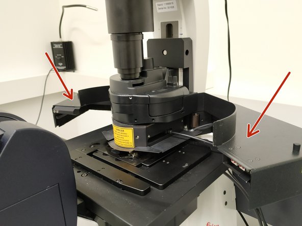 An interlocked &quot;Laser Protection Cover&quot; is attached to the condenser arm to protect from the strong laser illumination needed for imaging.
