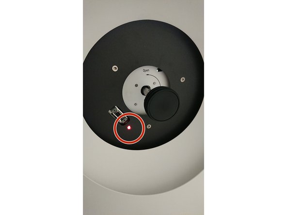 The red light is on until the evacuation of the airlock is finished. Only continue if the light disappeared.