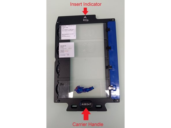 Load the slide carrier with the insert indicator in front.