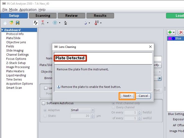 If there is a sample plate in the microscope, the wizard will open the tray and asks you to remove it.