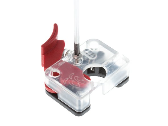 With a #1 Phillips screwdriver, remove the single #1 Phillips drive screw from the SeeMeCNC EzStruder Top.