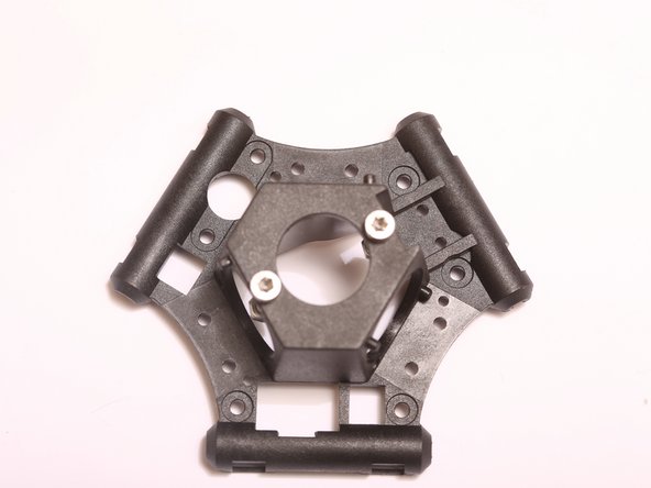 Thread 2x M3 x 18mm SHCS through the top of the end effector, and secure with M3 nuts, threading the screw 3-4 turns past the nut to ensure that it will not fall out accidentally.