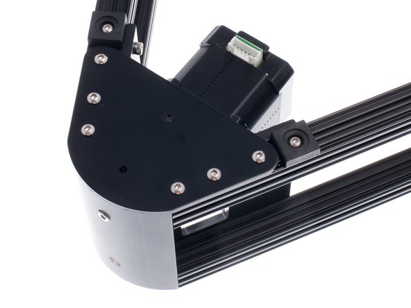 Install an OpenBeam Feet on each side of the vertex cap plate.  Once the feet are in position, you may apply the rubber adhesive bumpon over the screw.