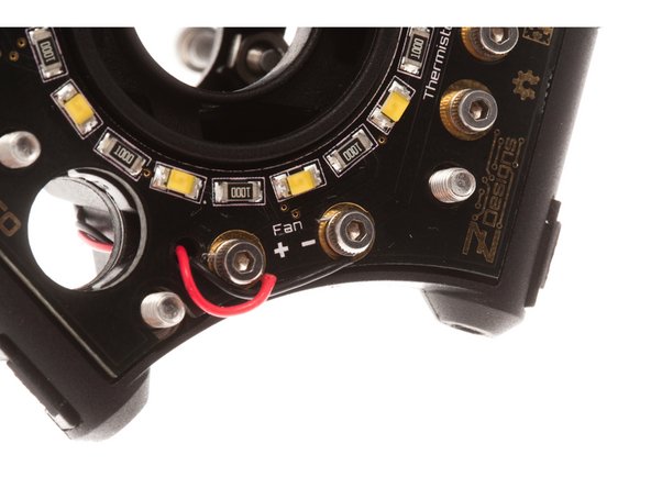 Loosen each M2 screw by about 2 turns.  Using the tip of the screw driver, tuck the tinned ends of the cable under the screw.