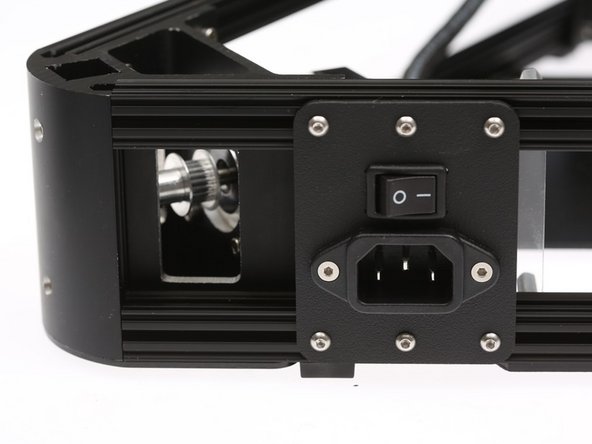 Loosen up some of the pre-loaded nuts, and  install the power inlet panel as shown on the right, on the X-Z side of the printer.