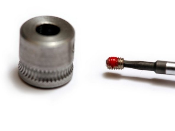 The knurled pulley, sometimes called a hobbed pulley, is what grips the plastic filament for feeding into the printer