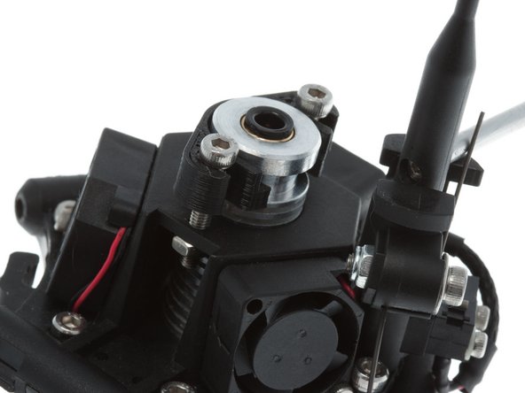 Slide the bottom clamp on.  This is the thicker of the two printed pieces.