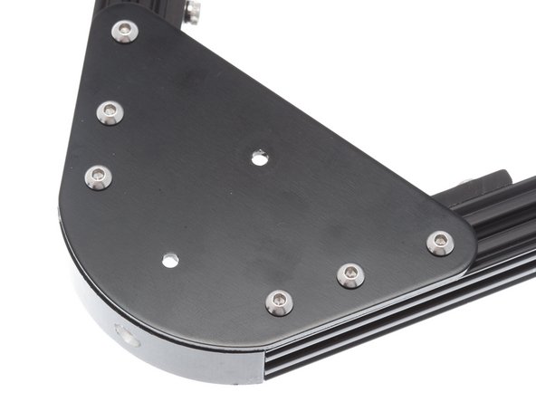 Using M3 x 6mm Button Head Cap Screws (BHCS), install vertex cap plates over the end of each vertex.