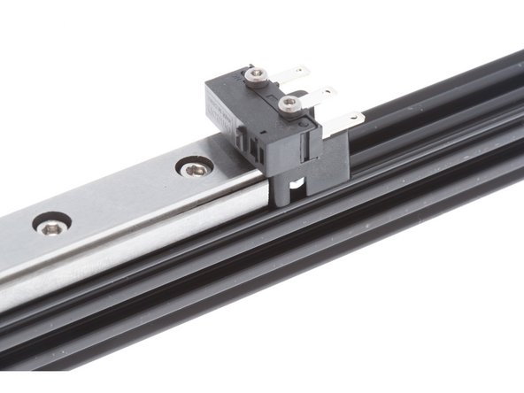 Each M3 x 8mm SHCS goes through an M3 Lock Washer before going into the counterbore hole. See picture for fastener stack for the linear rail.