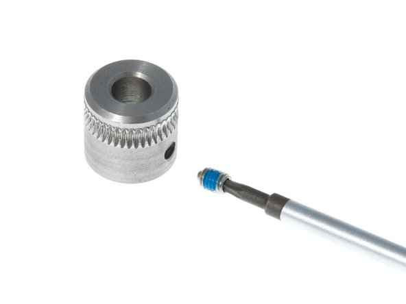 The knurled pulley, sometimes called a hobbed pulley, is what grips the plastic filament for feeding into the printer