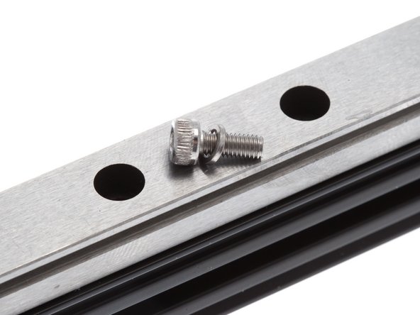 Be extremely careful not to let the carriage slide off the end of the rail. This could result in loss of bearings.