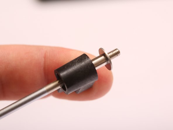 Keeping the clamp piece oriented as shown, load the spring / shoulder bolt / clamp assembly onto the end of the 2mm hex driver and compress the spring.