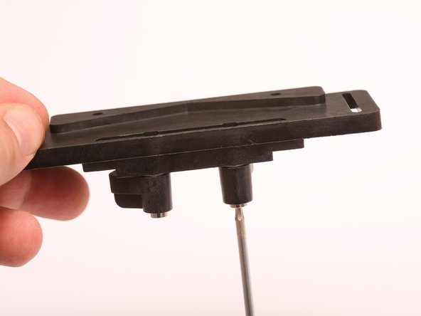 Place fender washer onto the threaded portion of the shoulder bolt.