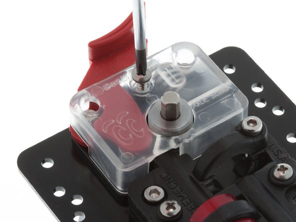 Using #1 Phillips Screwdriver, reinstall plastic cover onto EzStruder.