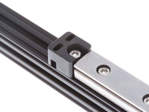Install the empty endstop holders at the opposite end of the rail, using an M3 8mm SHC Screw &amp; M3 Nut. Ensure that it is snug against the rail.