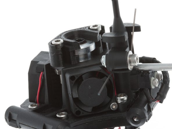 Install the top clamp; pull up on the clamp mounting screws and finger tighten the screws.  We'll clamp the K-Head down in place in a minute, but for now we need to make sure that the heat block is oriented correctly in the end effector housing so it doesn't crash into the glass during auto levelling probe retract.