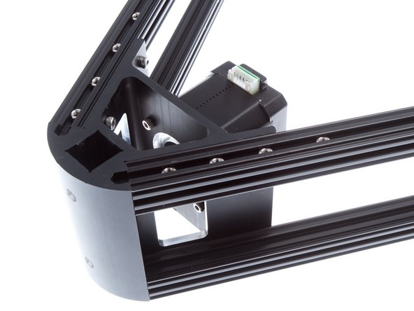 Install Stepper Motor + Pulley set, using M3 x 8mm SHCS.  Make sure that the motor connections all face the same way (away from the dot)