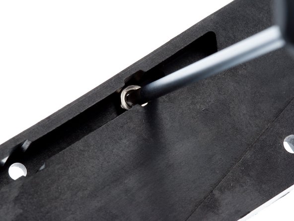 Orient the bed clamp part as shown below.  One at a time, load a M3 nut into the highlighted position.