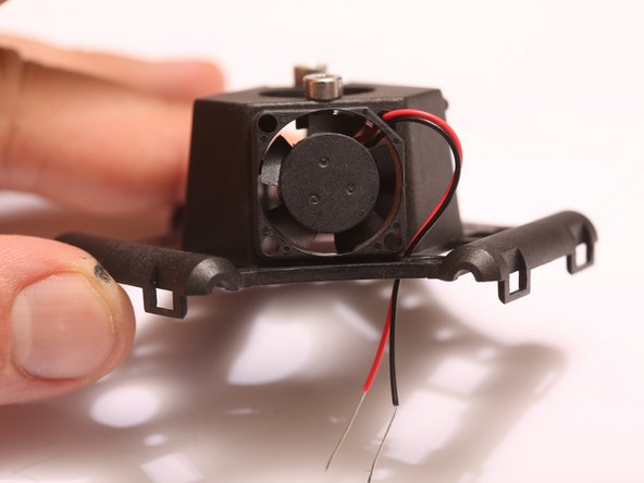 Look for the absent of a plastic peg holding the fan, that is the corner that the wires should go.