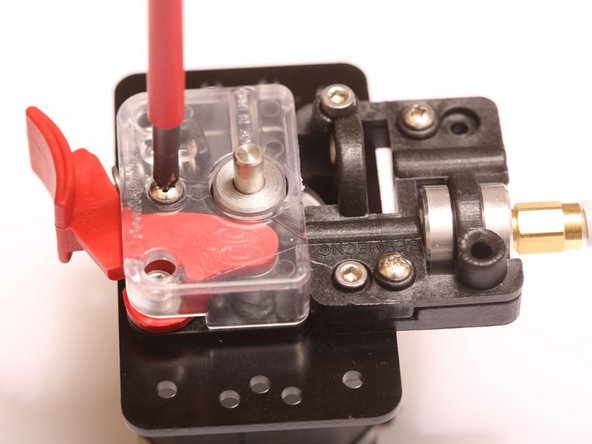 Using #1 Phillips Screwdriver, reinstall plastic cover onto EzStruder.